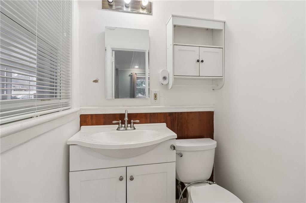 716 Carolina Road Marietta, GA 30008 - Photo 42 of 71 a bathroom with a toilet sink and mirror