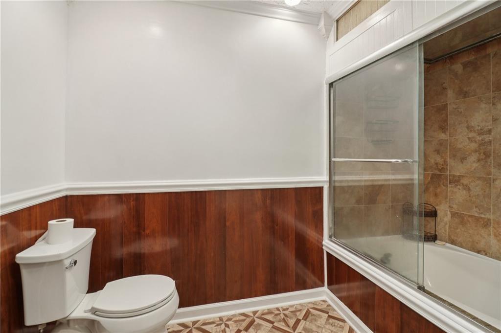 716 Carolina Road Marietta, GA 30008 - Photo 44 of 71 a bathroom with a toilet and a shower