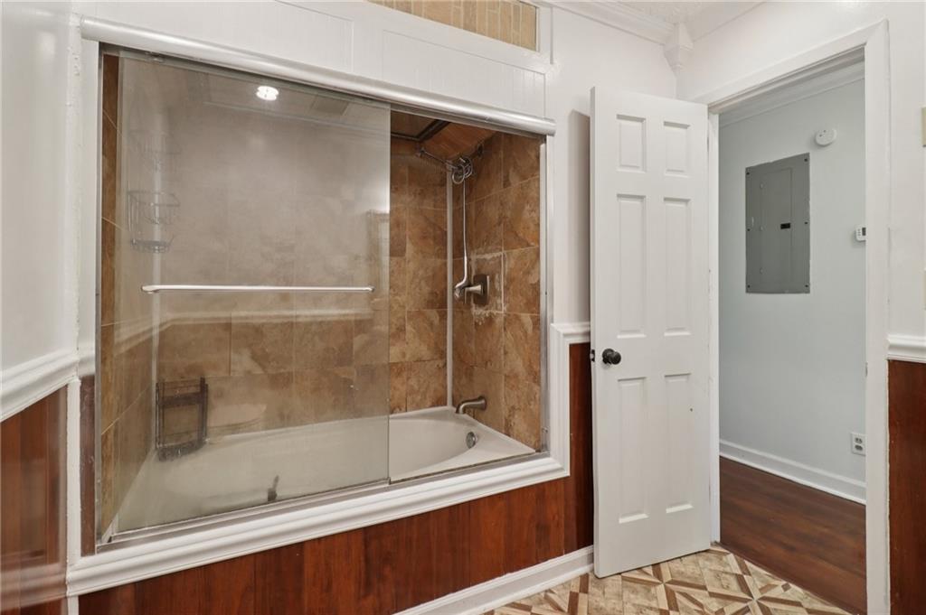 716 Carolina Road Marietta, GA 30008 - Photo 49 of 71 a bathroom with a bathtub and a shower