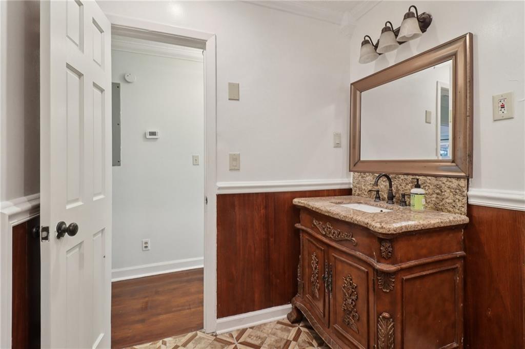 716 Carolina Road Marietta, GA 30008 - Photo 51 of 71 a bathroom with a sink and a mirror