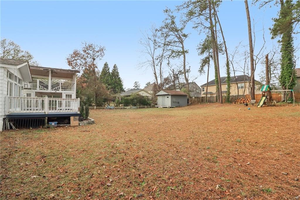 716 Carolina Road Marietta, GA 30008 - Photo 64 of 71 a view of a house with yard and covered with snow in the background