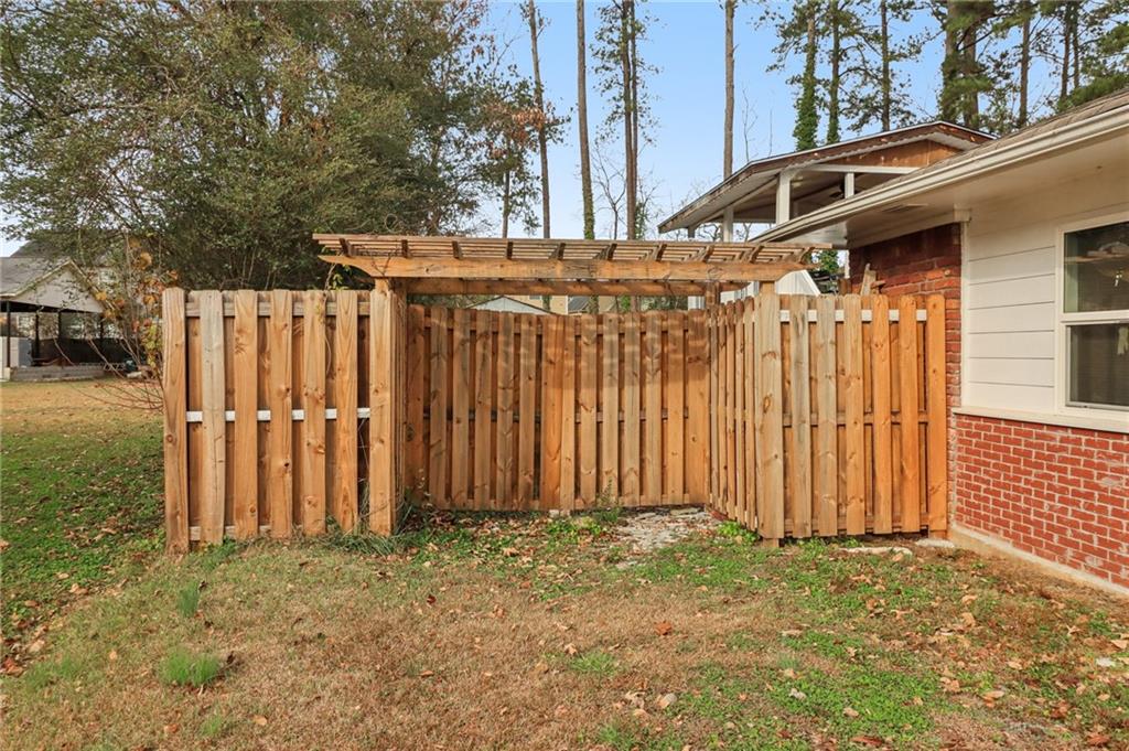 716 Carolina Road Marietta, GA 30008 - Photo 67 of 71 a view of a house with a wooden fence