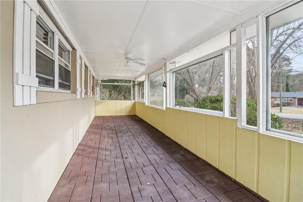 716 Carolina Road Marietta, GA 30008 - Photo 7 of 71 a view of an empty room with wooden floor and a window