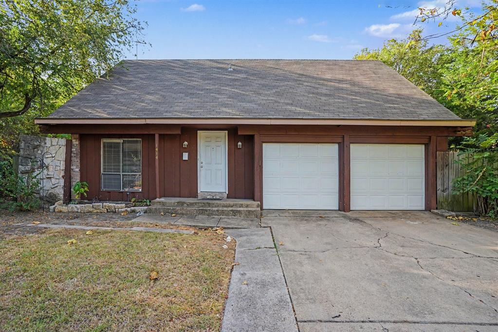 1414 Finley Road Irving, TX 75062 - Photo 1 of 27 Exterior featuring a brown facade, a two-car garage, and a concrete driveway