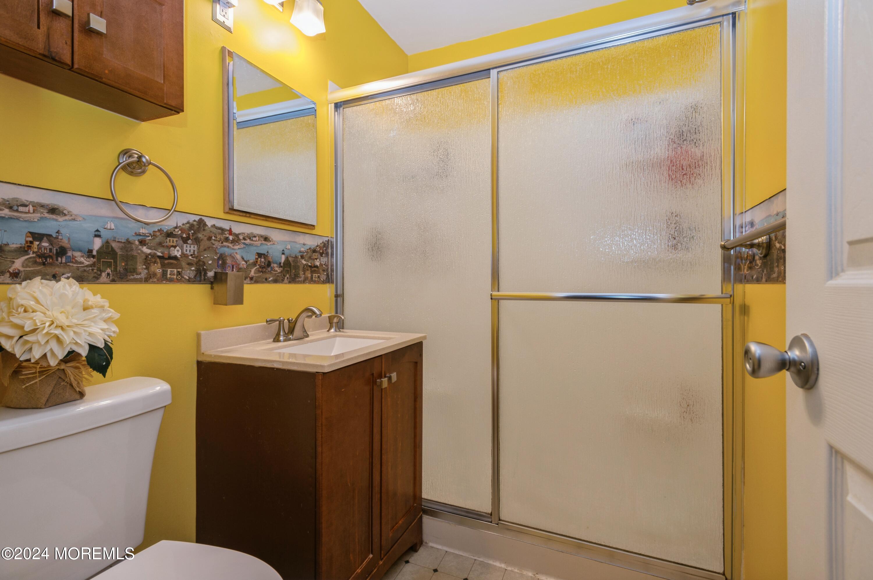 62 Capri Drive Brick, NJ 08723 - Photo 16 of 22 a bathroom with a sink mirror vanity and toilet