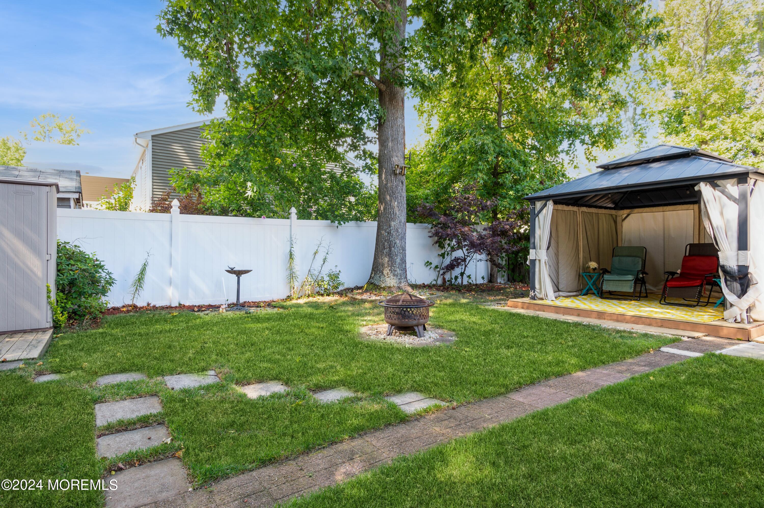 62 Capri Drive Brick, NJ 08723 - Photo 19 of 22 a view of a house with backyard and sitting area