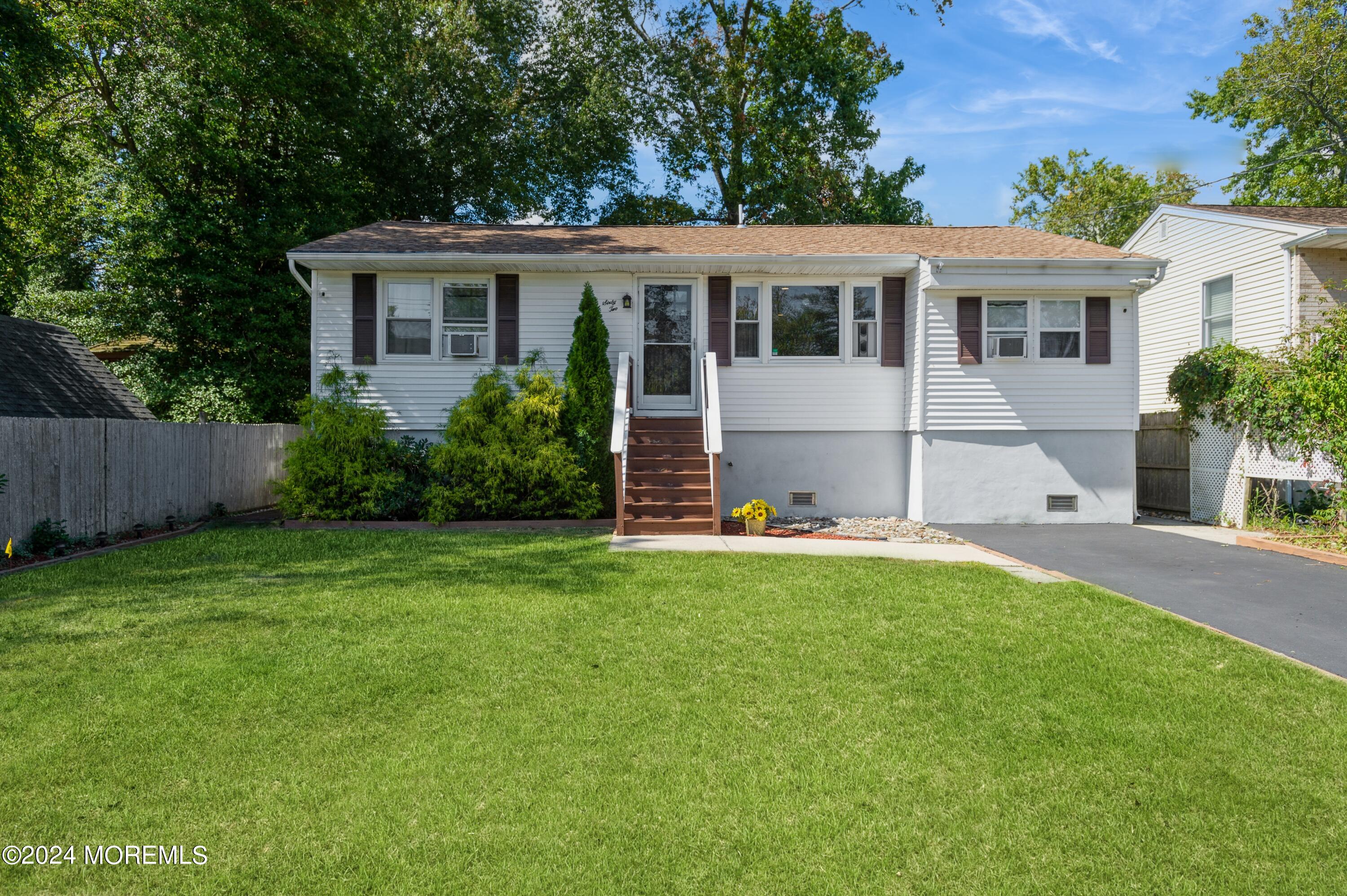 62 Capri Drive Brick, NJ 08723 - Photo 2 of 22 a view of a house with a yard and plants