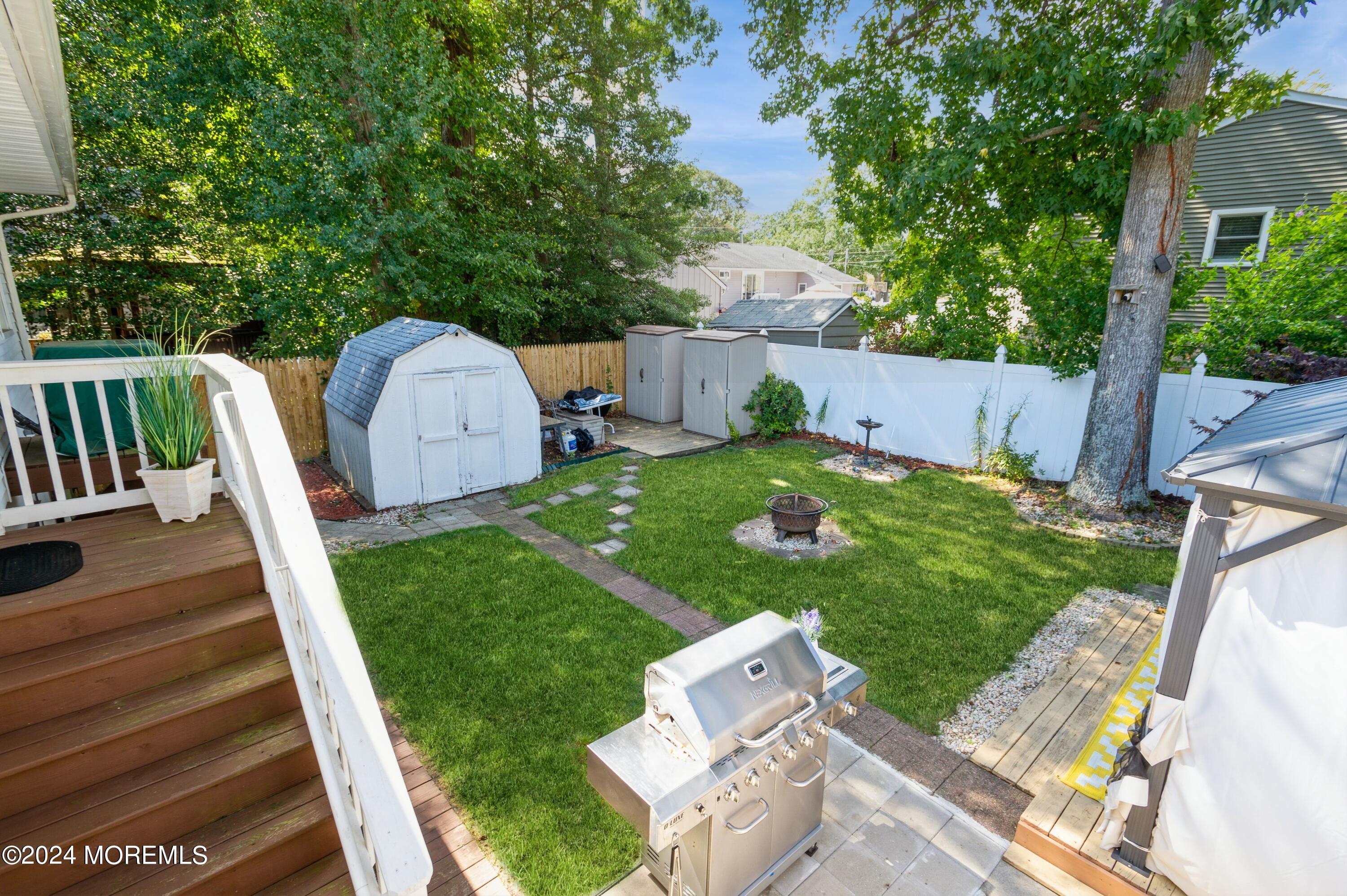 62 Capri Drive Brick, NJ 08723 - Photo 3 of 22 a view of backyard with a garden and plants