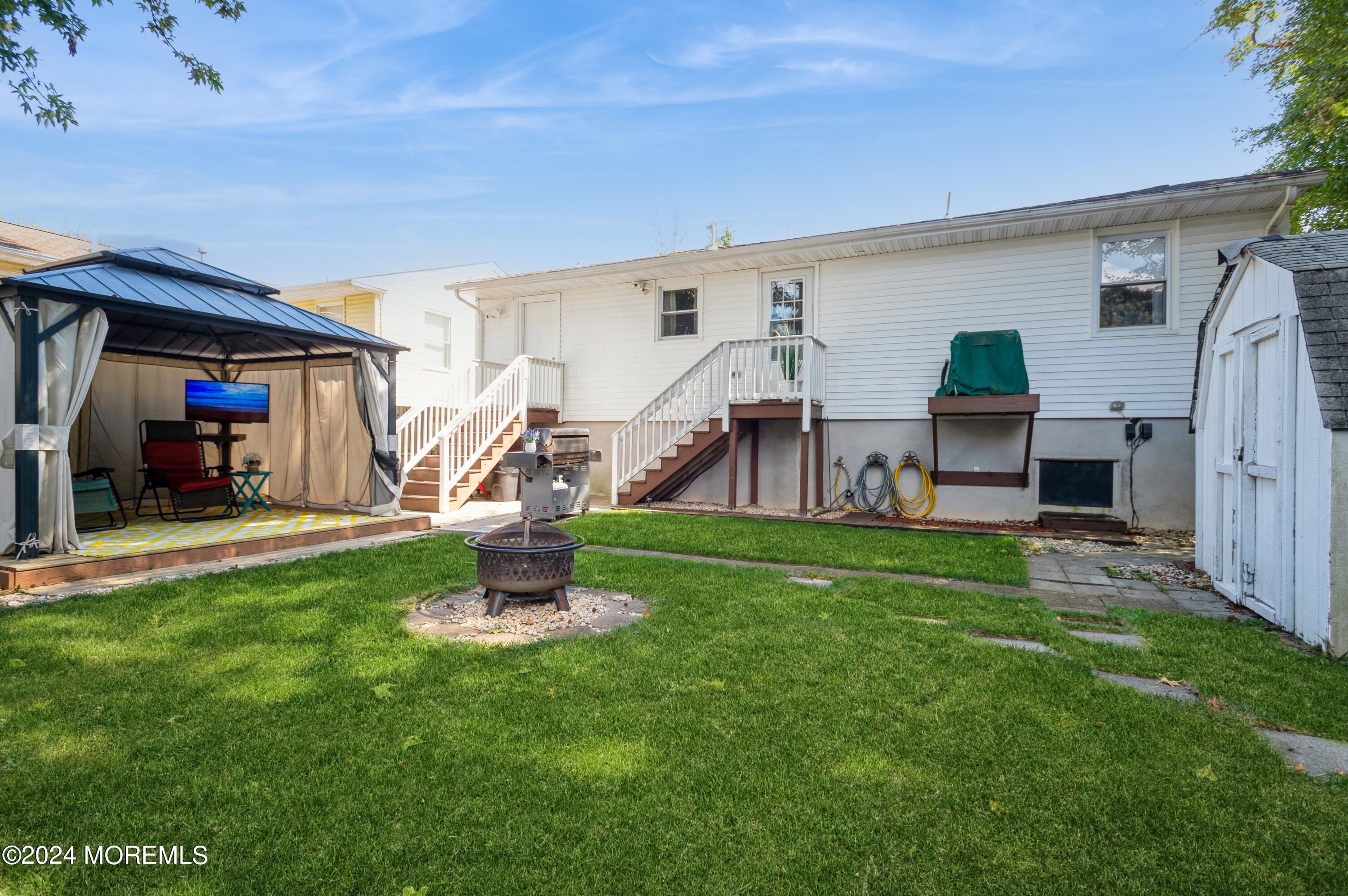62 Capri Drive Brick, NJ 08723 - Photo 4 of 22 a view of a house with a backyard
