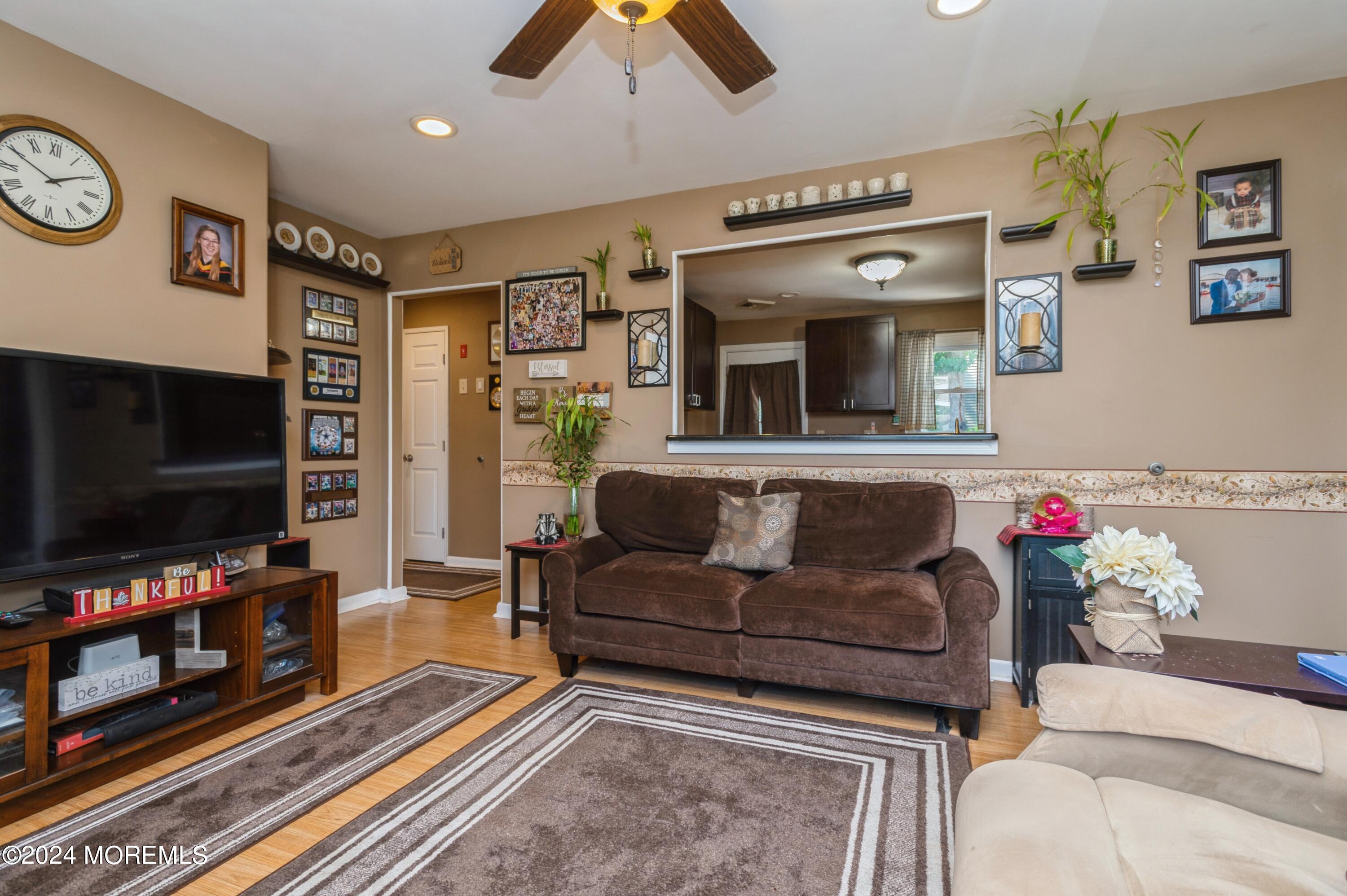 62 Capri Drive Brick, NJ 08723 - Photo 8 of 22 a living room with furniture and a flat screen tv