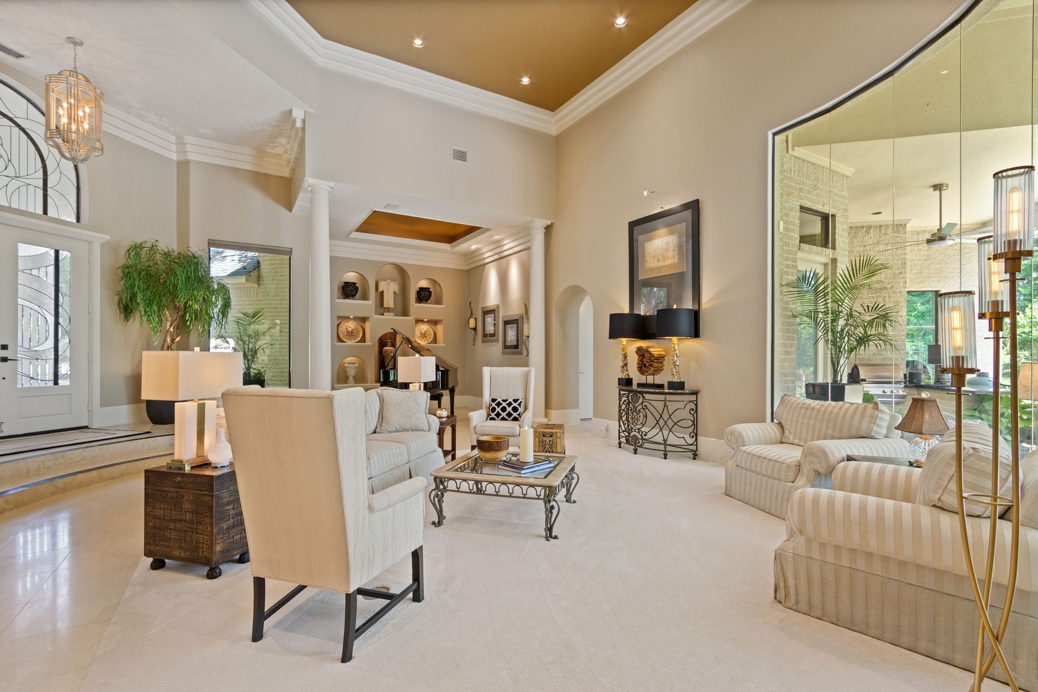 17511 Seidel Road Tomball, TX 77377 - Photo 15 of 49 Another view of this spacious living area features high ceilings, elegant columns, and plenty of lighting. The open layout creates a welcoming and luxurious atmosphere ideal for entertaining or relaxing.