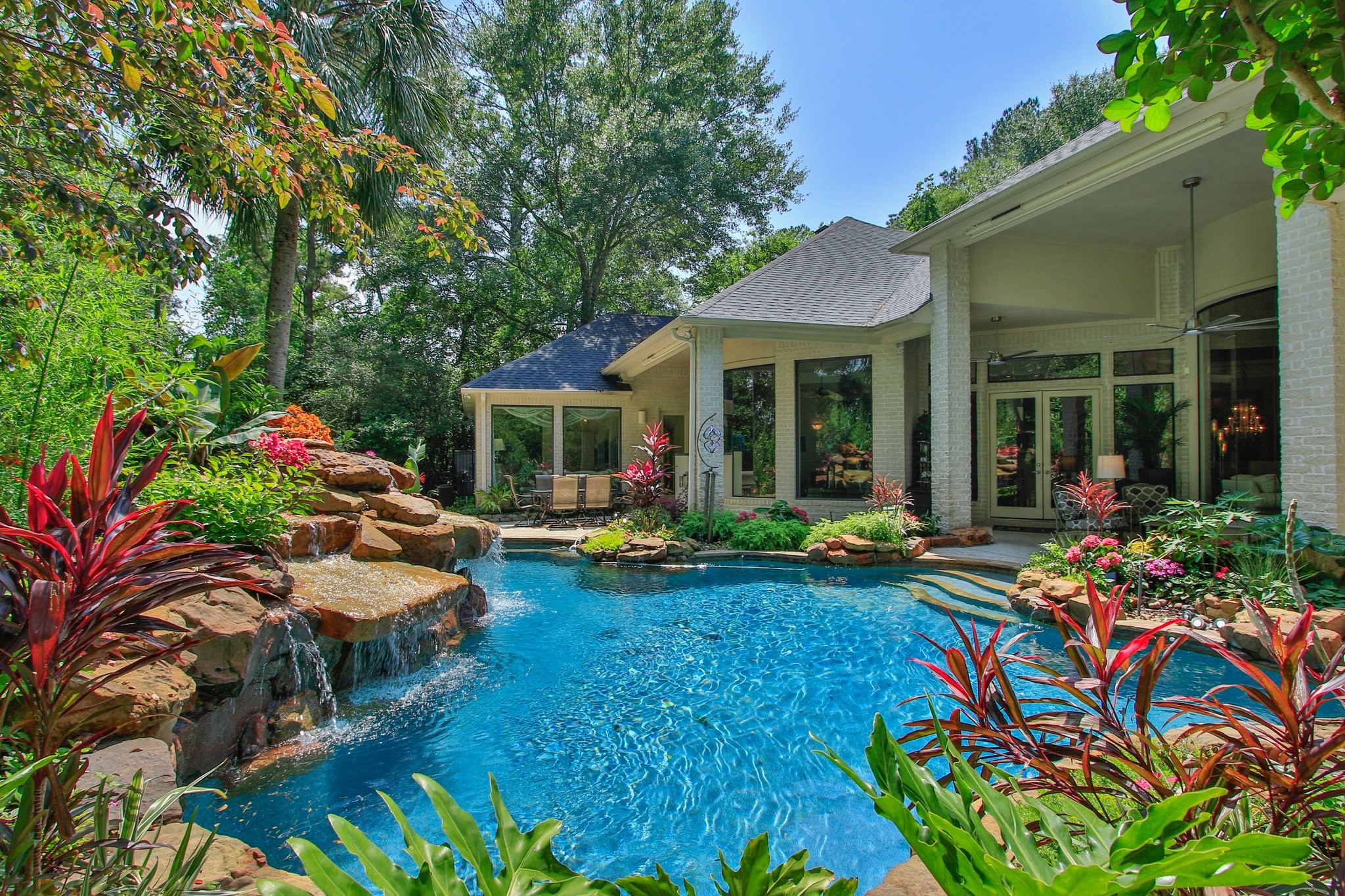 17511 Seidel Road Tomball, TX 77377 - Photo 7 of 49 This 1.6 acre lot is beautifully landscaped around the home with natural forest borders for ultimate privacy. At night the home transforms, taking the on ambiance of an island resort, with stunning views through its expansive walls of glass!