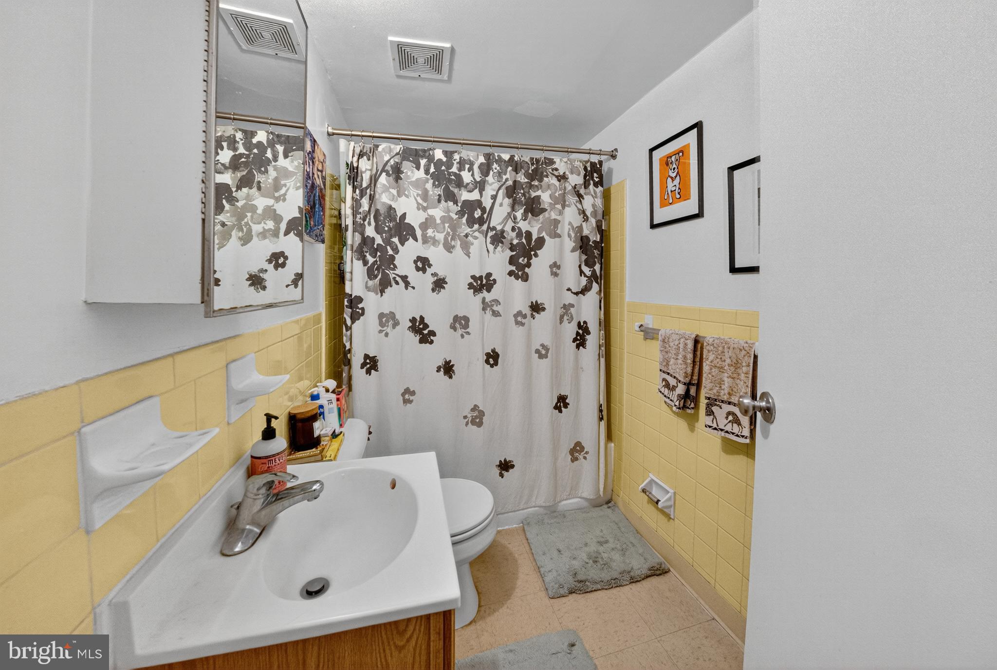 1440 W Street Northwest, Unit 304 Washington, DC 20009 - Photo 11 of 15 a bathroom with a sink and a tub