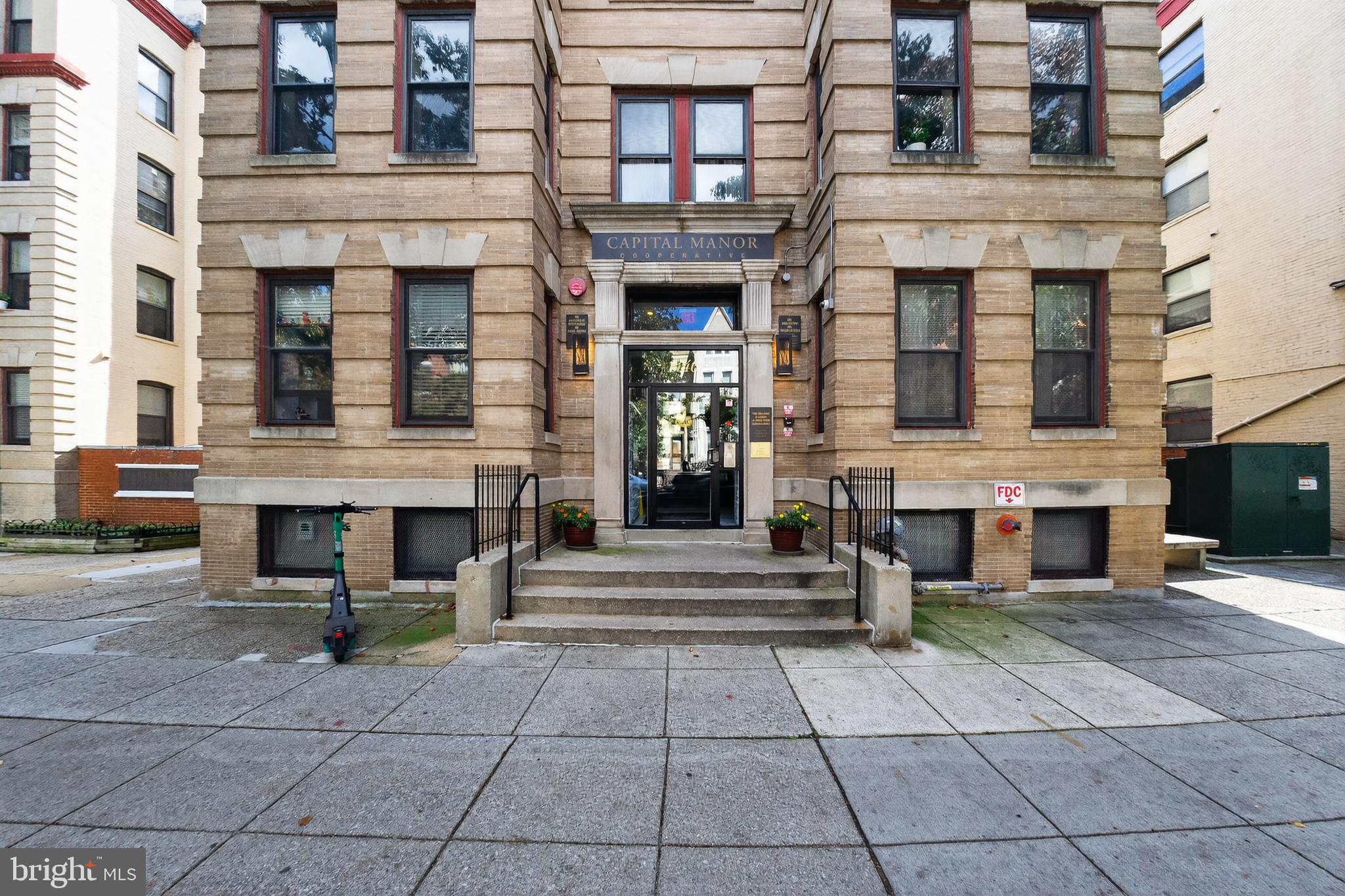 1440 W Street Northwest, Unit 304 Washington, DC 20009 - Photo 12 of 15 a view of a brick building with many windows
