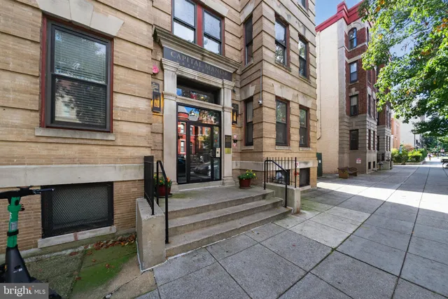 a front view of a building with street view