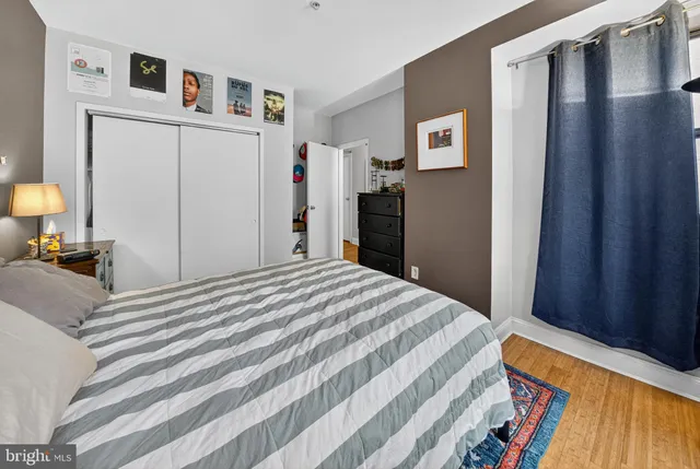 a bedroom with a bed and a lamp