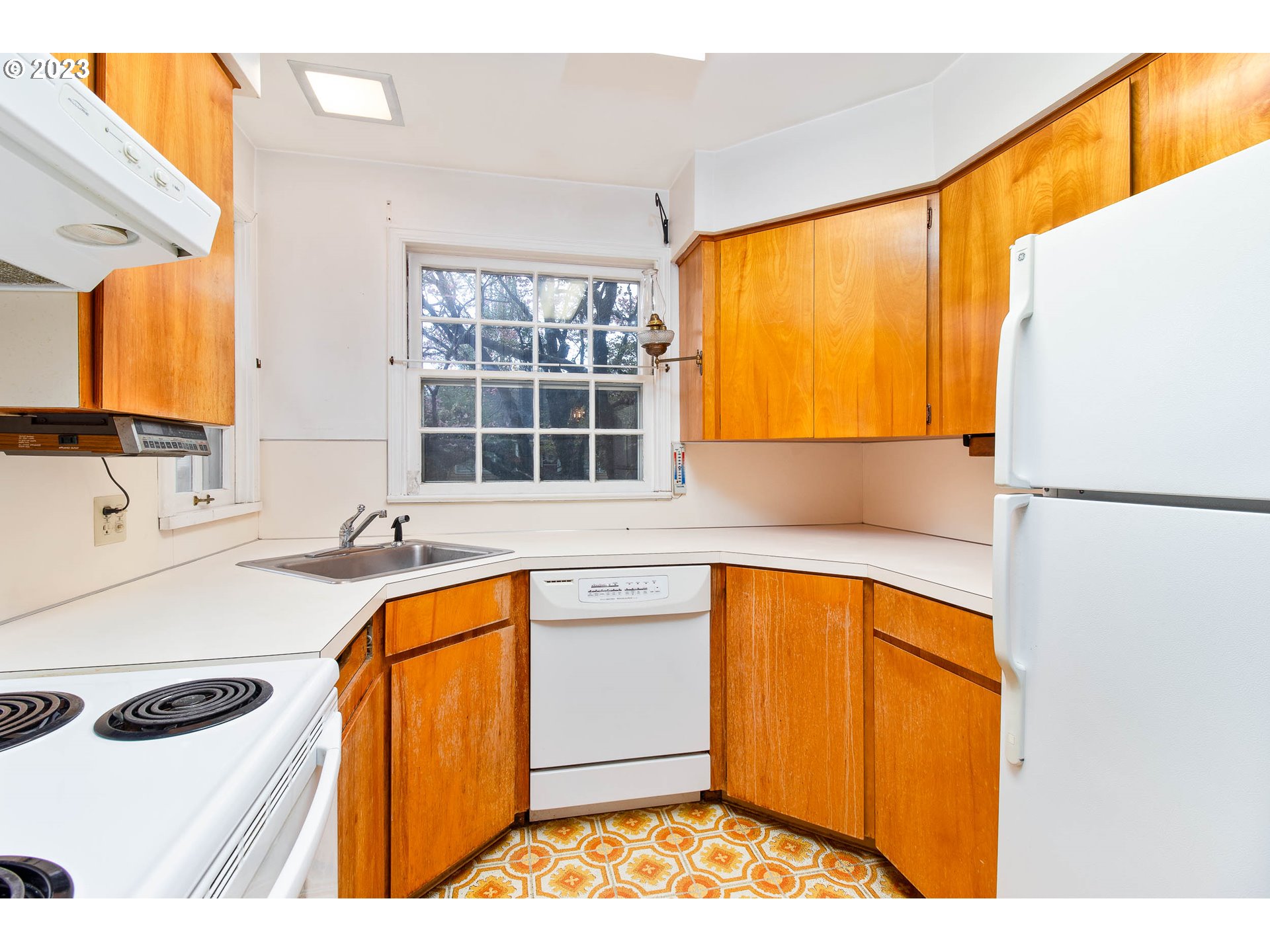 7343 North Foss Avenue Portland, OR 97203 - Photo 13 of 39 a kitchen with stainless steel appliances granite countertop a sink and a refrigerator