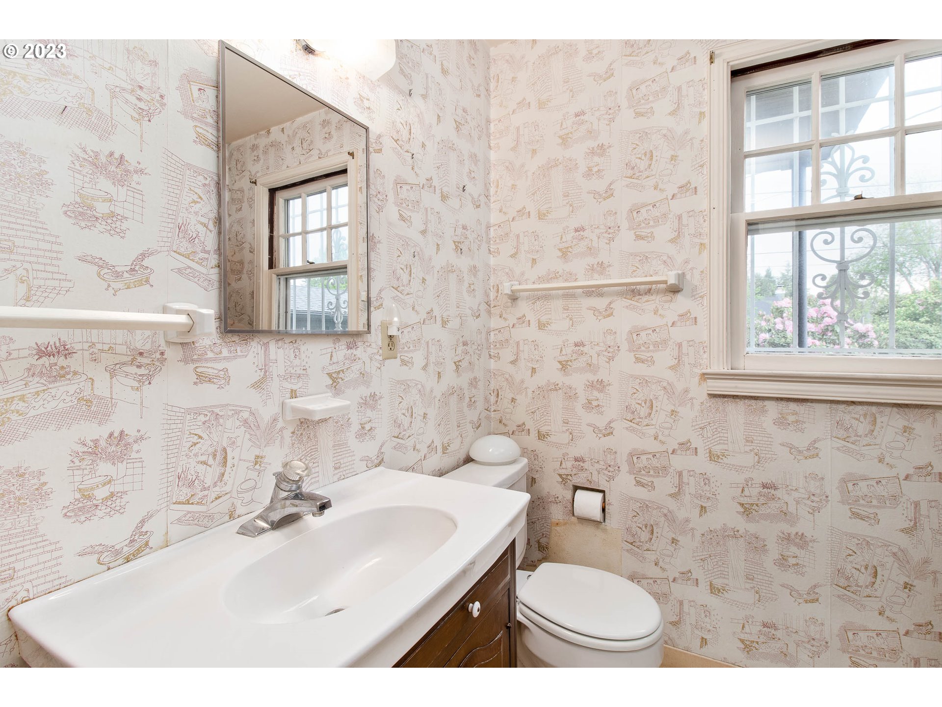 7343 North Foss Avenue Portland, OR 97203 - Photo 17 of 39 a bathroom with a sink a toilet and a mirror