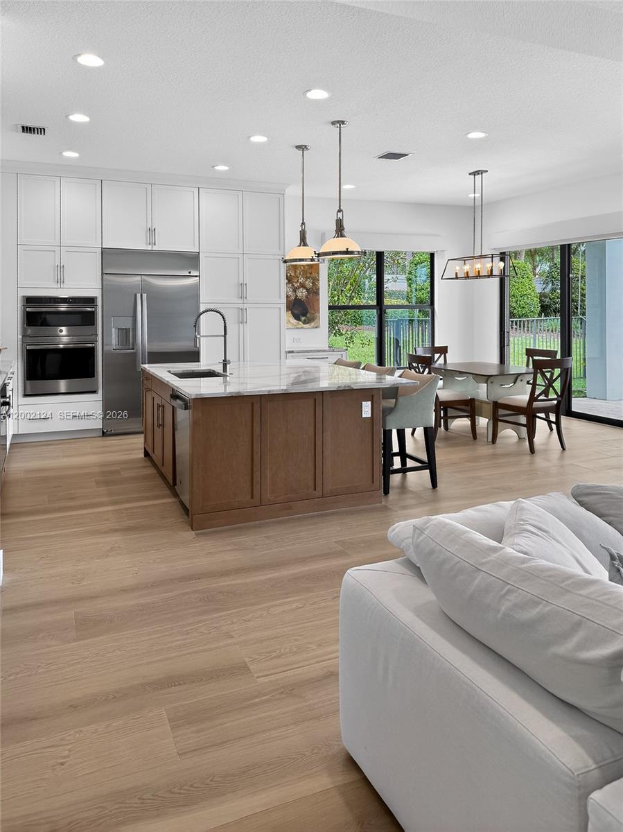 8871 New River Falls Road Boca Raton, FL 33496 - Photo 11 of 47 Kitchen Island and Dining area
