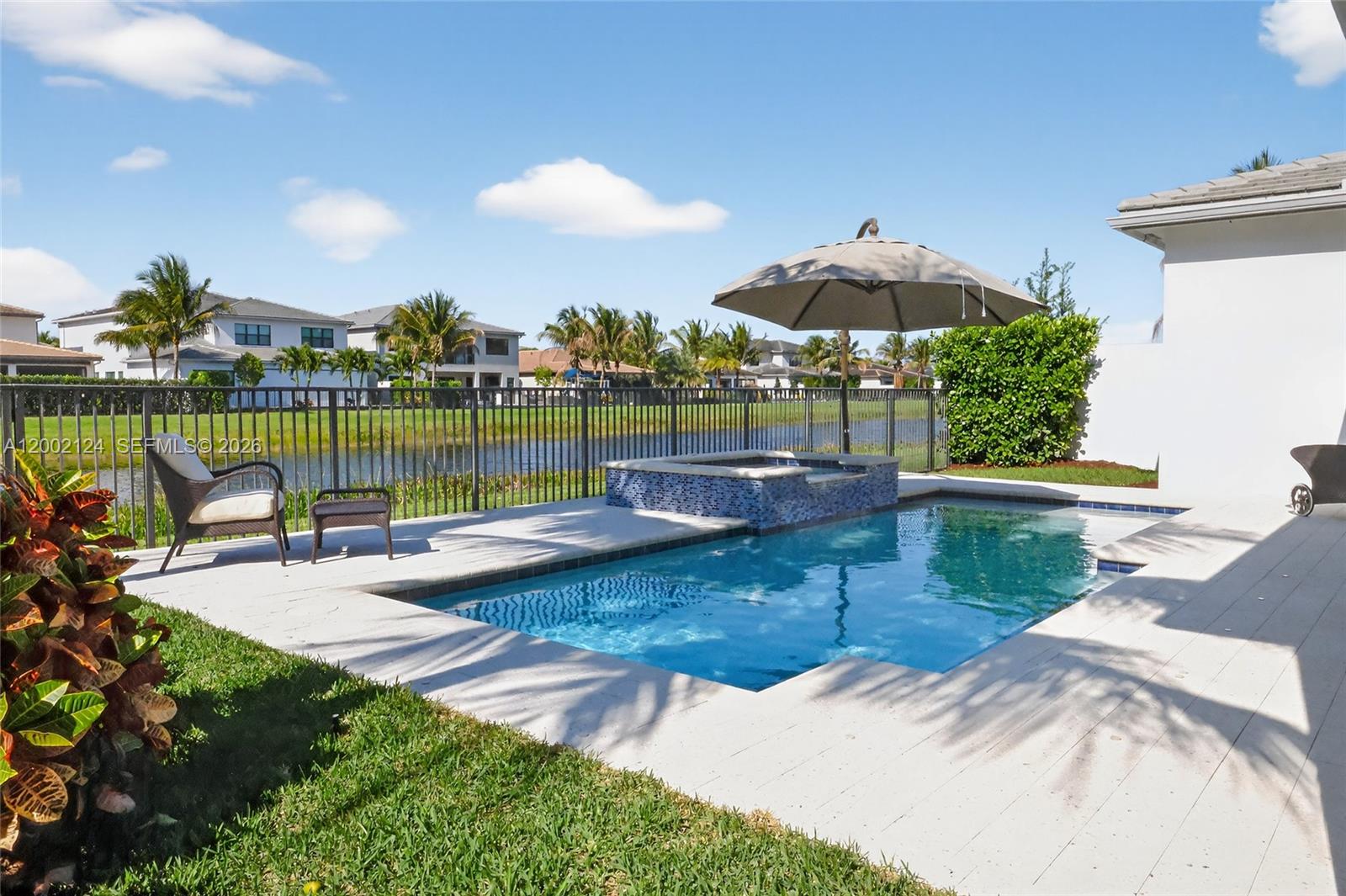 8871 New River Falls Road Boca Raton, FL 33496 - Photo 3 of 47 Heated Pool and Lake NE view