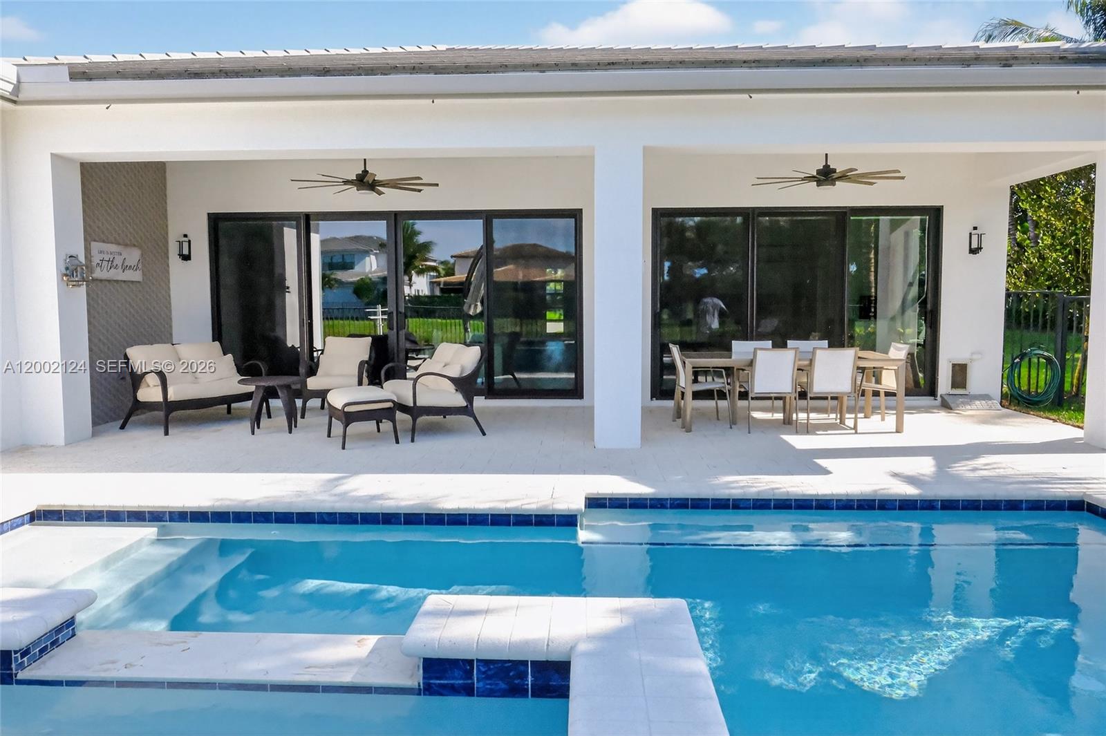 8871 New River Falls Road Boca Raton, FL 33496 - Photo 31 of 47 Pool and 35' Covered Porch w sitting and dining areas