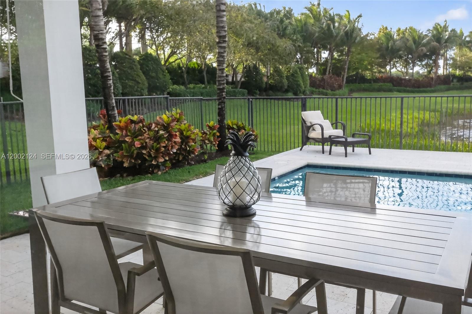8871 New River Falls Road Boca Raton, FL 33496 - Photo 32 of 47 Covered Porch Dining area