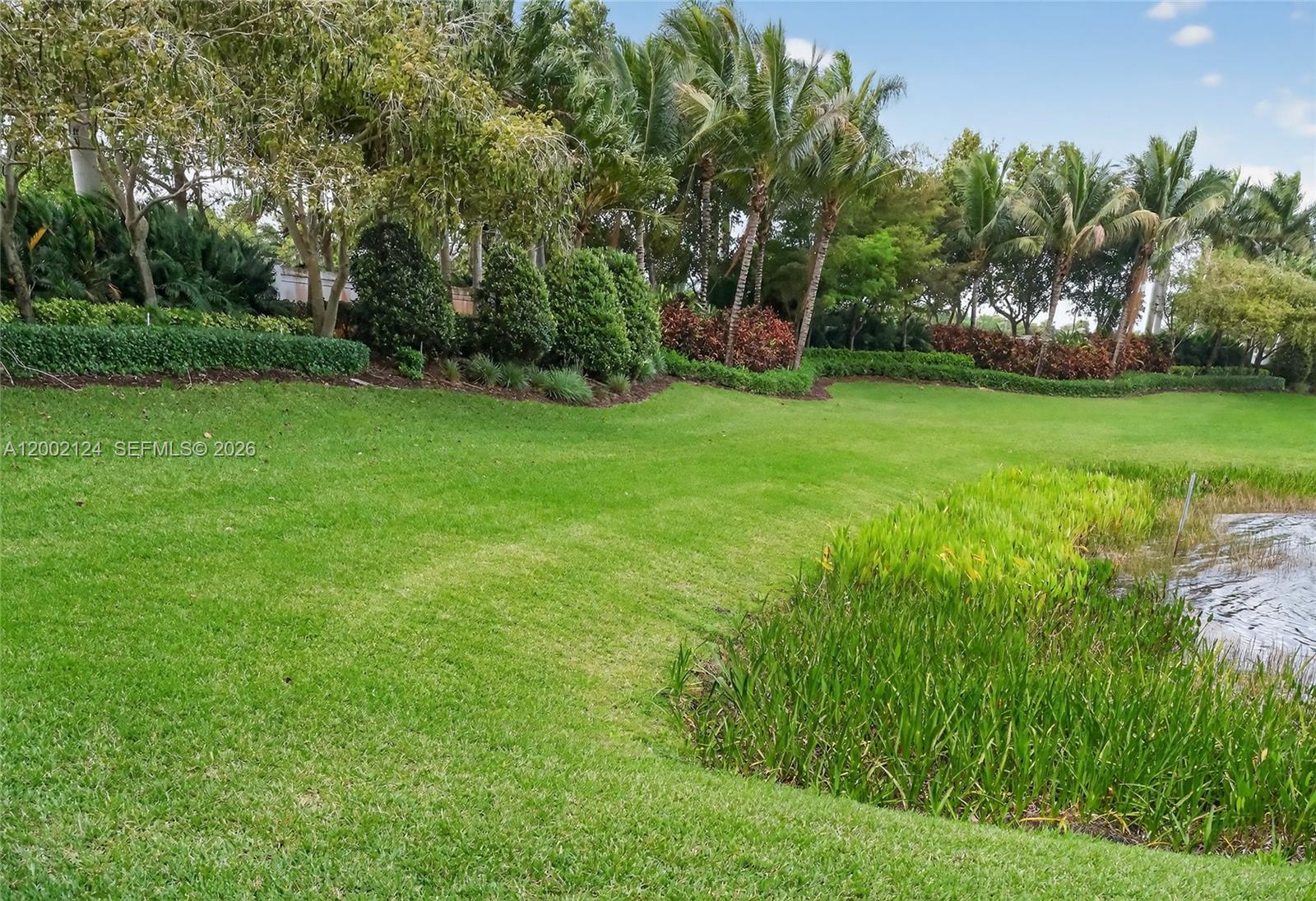 8871 New River Falls Road Boca Raton, FL 33496 - Photo 37 of 47 a view of a backyard with a garden