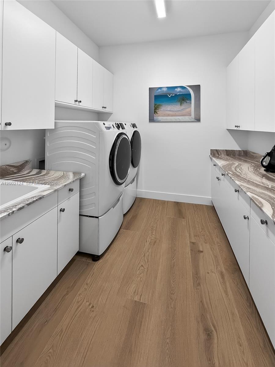 8871 New River Falls Road Boca Raton, FL 33496 - Photo 39 of 47 a kitchen with a cabinets and wooden floor