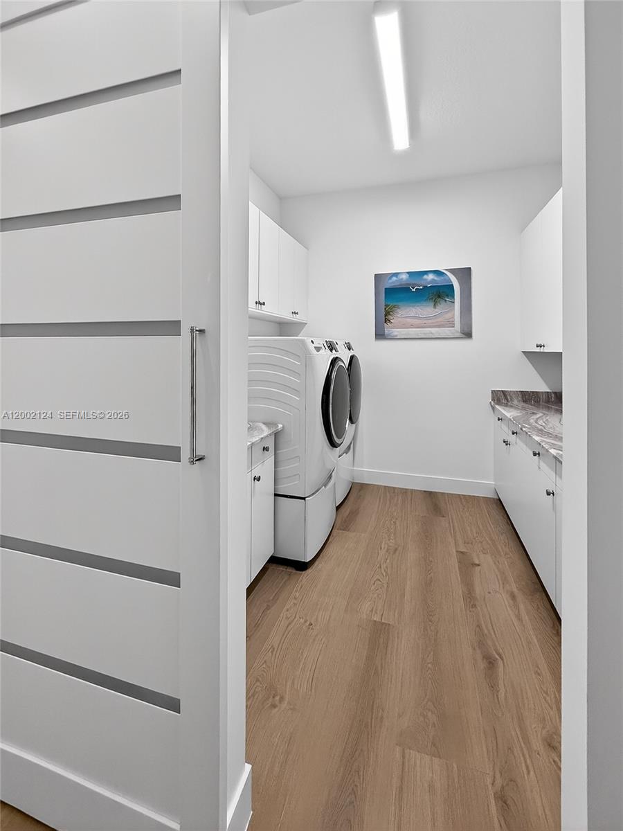 8871 New River Falls Road Boca Raton, FL 33496 - Photo 40 of 47 a view of a storage & utility room with washer and dryer