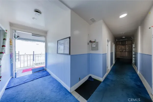 a view of entryway and kitchen