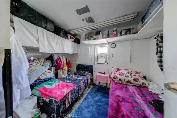 a bed room with a bed and a window