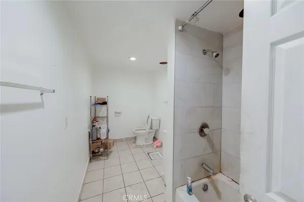 a bathroom with a bathtub and toilet