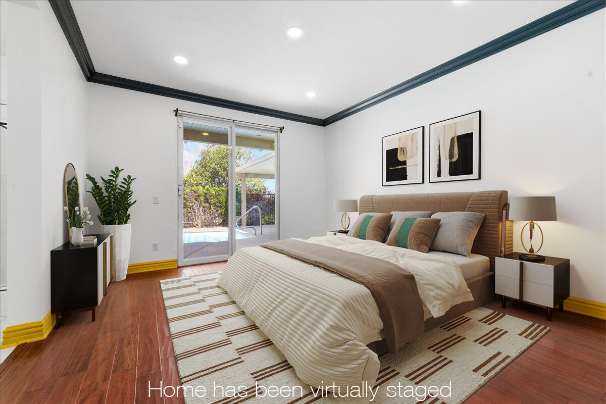 23732 Bella Vista Road Corona, CA 92883 - Photo 19 of 49 a spacious bedroom with a large bed and a potted plant