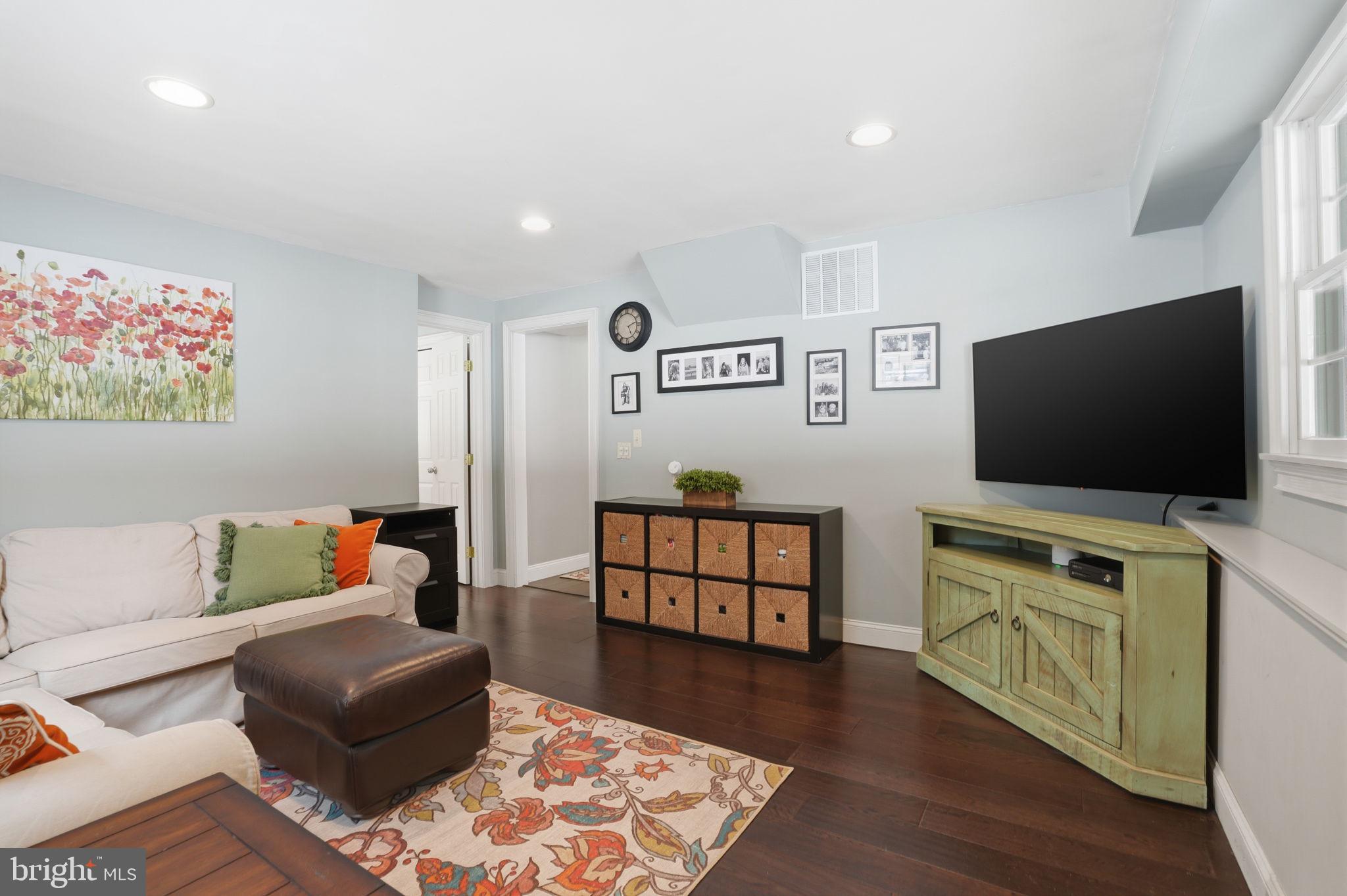 521 Cokesbury Road Annandale, NJ 08801 - Photo 27 of 56 a living room with furniture and a flat screen tv