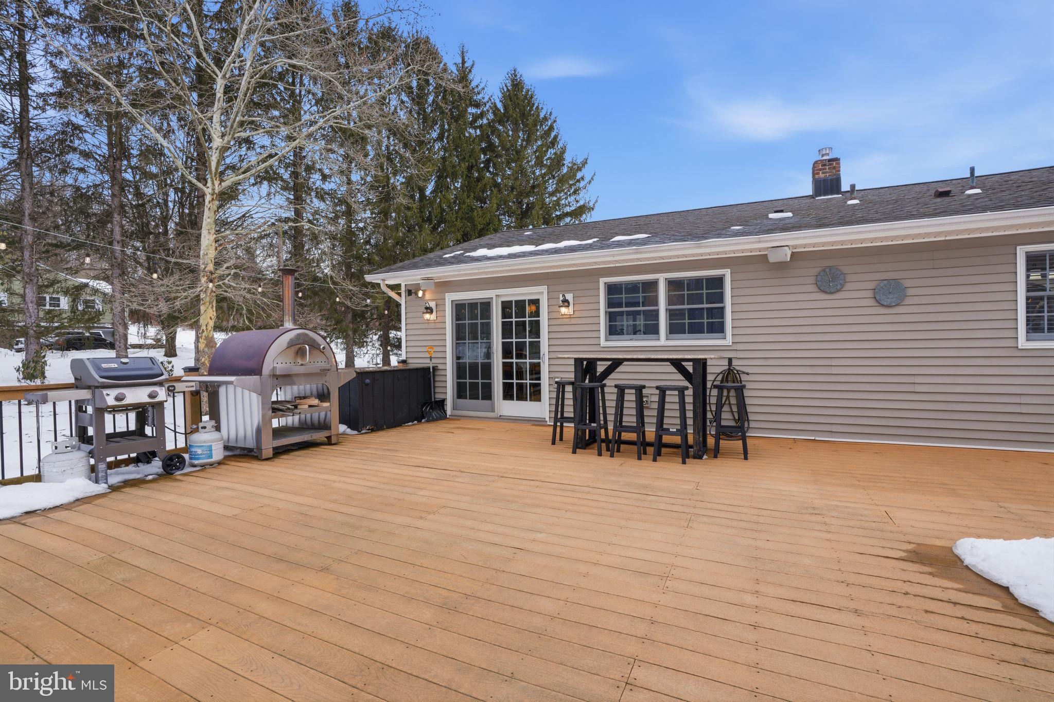 521 Cokesbury Road Annandale, NJ 08801 - Photo 30 of 56 a view of a house with chairs and deck