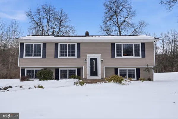 front view of a house with a yard
