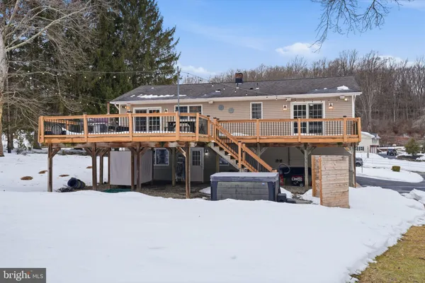 a front view of a house with large windows