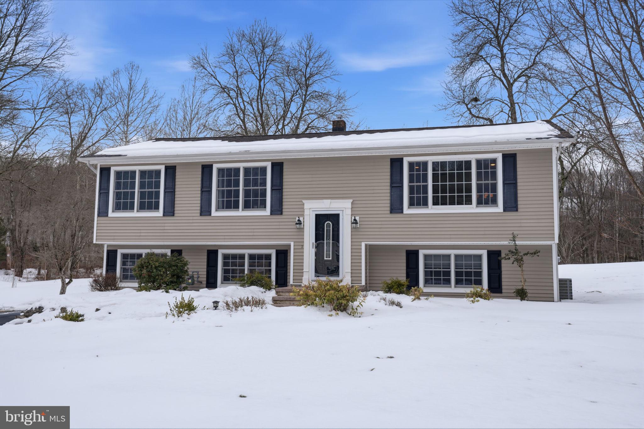 521 Cokesbury Road Annandale, NJ 08801 - Photo 4 of 56 a front view of a house with a yard covered in snow