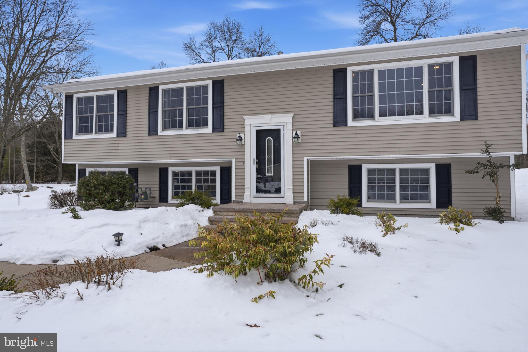 521 Cokesbury Road Annandale, NJ 08801 - Photo 5 of 56 a front view of a house with a yard