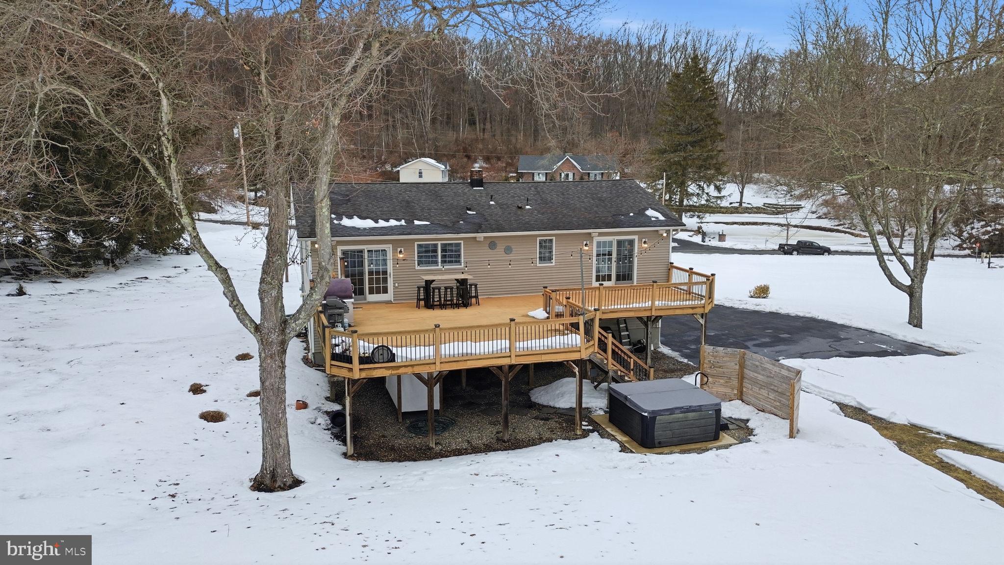 521 Cokesbury Road Annandale, NJ 08801 - Photo 52 of 56 a view of a patio with table and chairs with wooden fence