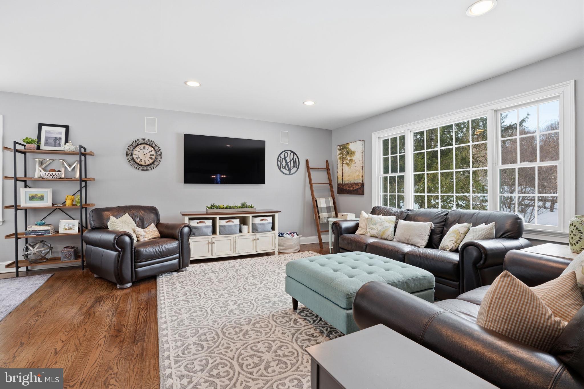521 Cokesbury Road Annandale, NJ 08801 - Photo 7 of 56 a living room with furniture and a flat screen tv