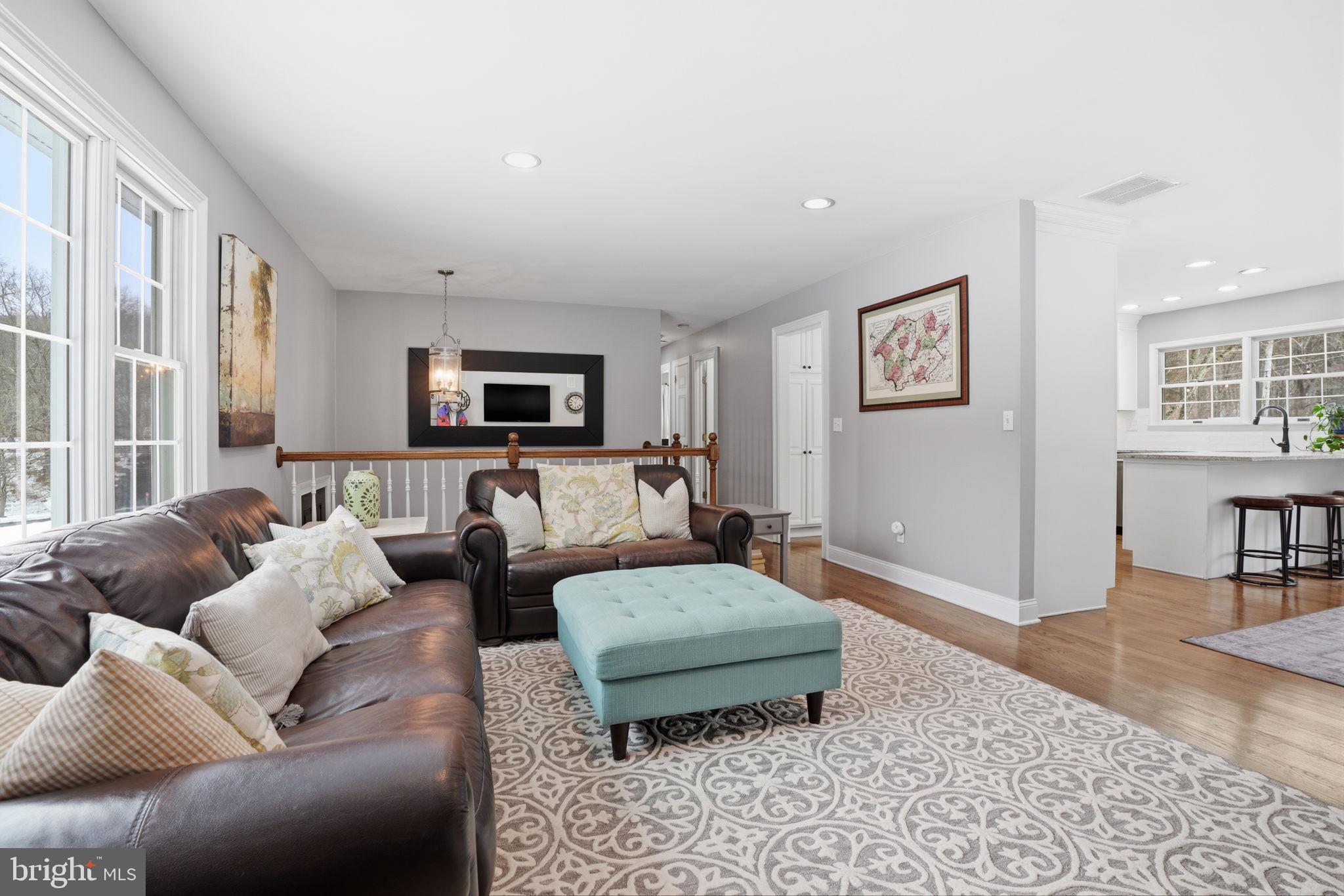 521 Cokesbury Road Annandale, NJ 08801 - Photo 8 of 56 a living room with furniture and a flat screen tv