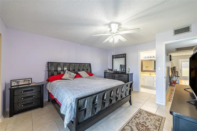 a bed room with a bed and a chandelier