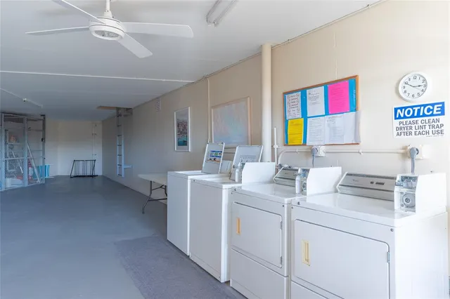 a view of storage and utility room with washer and dryer