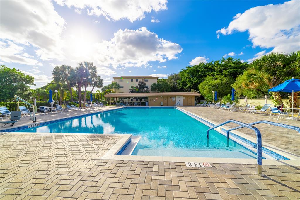 1902 Bermuda Circle, Unit L4 Coconut Creek, FL 33066 - Photo 25 of 27 Pool and Clubhouse Area