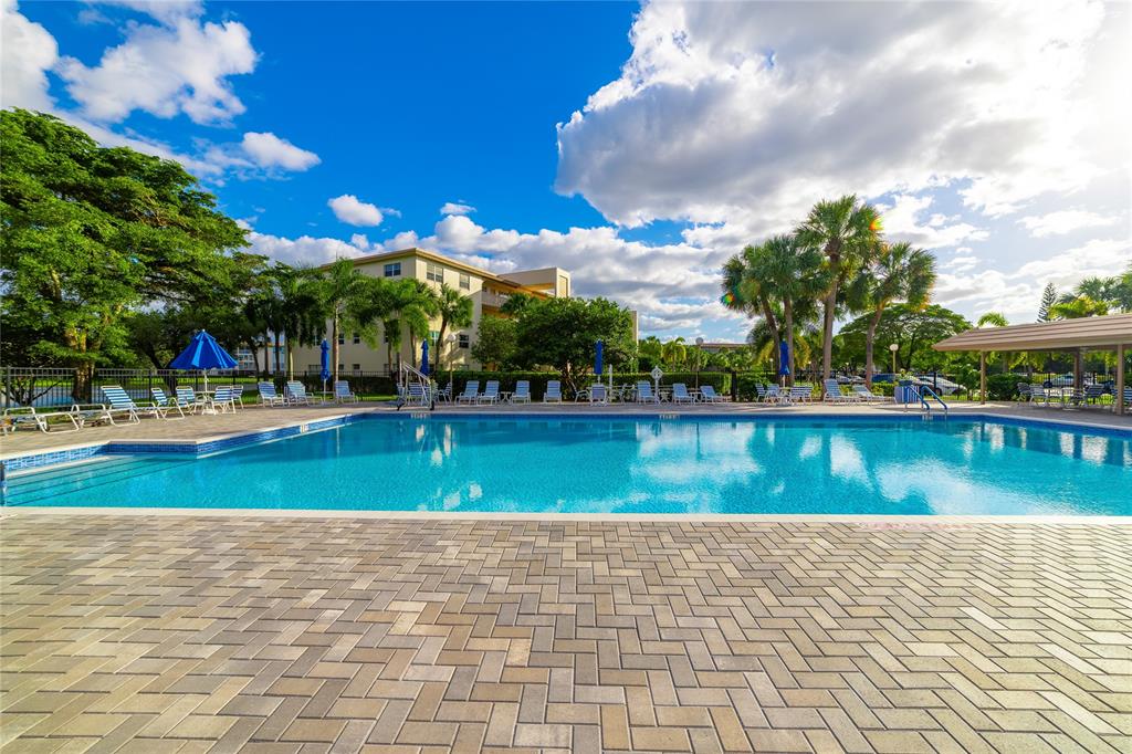 1902 Bermuda Circle, Unit L4 Coconut Creek, FL 33066 - Photo 26 of 27 Pool and Clubhouse Area