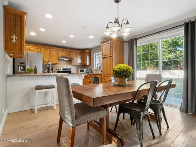 a kitchen with stainless steel appliances granite countertop a stove and a refrigerator