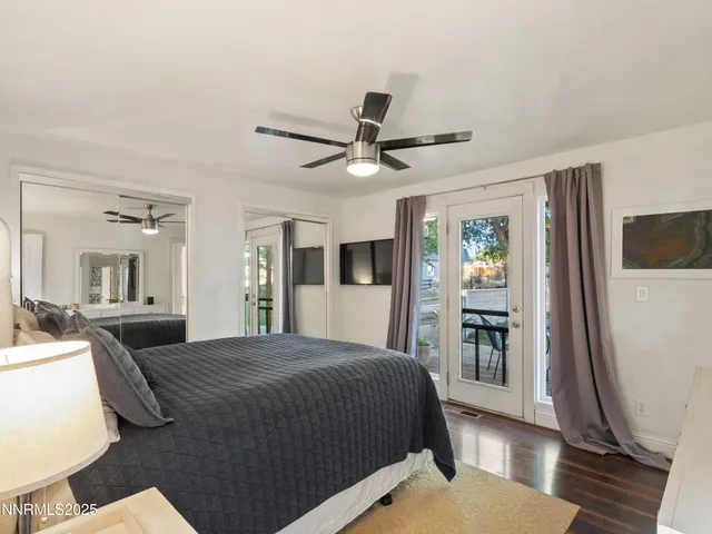 a view of a patio with table and chairs under an umbrella