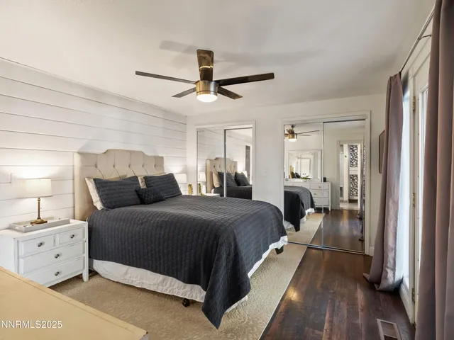 a view of a backyard with large trees