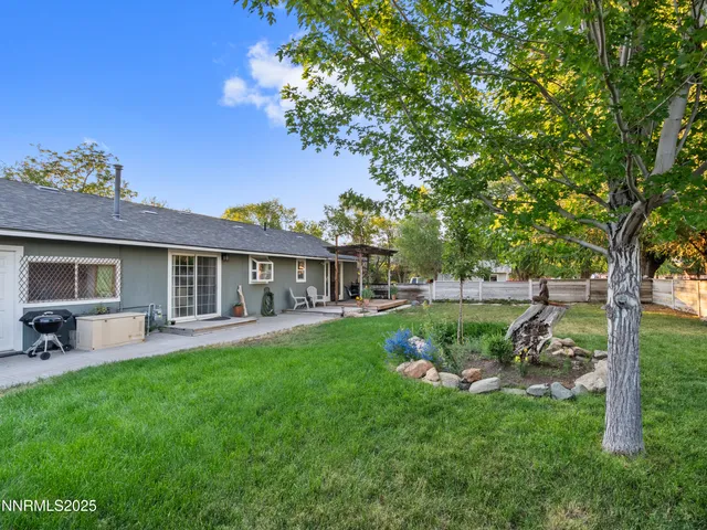 an aerial view of residential house and sandy dunes